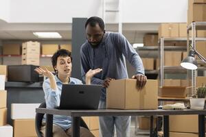 Staff members struggling with an order processing mix up in the supply room, managing distribution and getting angry due to import export trouble. Unhappy frustrated employees in depot. photo