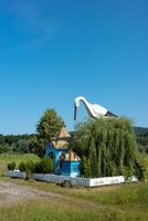 Chapel with Stork and Well in Teresva, Ukraine showcases unique architecture and nature photo