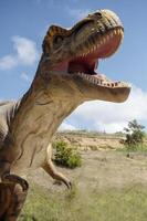 Huge Artificial dinosaur tyrannosaurus, close-up of dinosaur photo