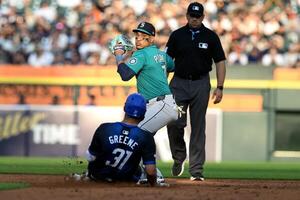 Seattle Mariners second baseman Jorge Polanco (7) turns a double play over sliding Detroit Tigers left fielder Riley Greene (31) in the second inning at Comerica Park. editorial_image