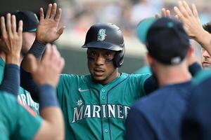 Seattle Mariners second baseman Jorge Polanco (7) celebrates in the dugout after scoring a run against the Detroit Tigers in the second inning at Comerica Park. editorial_image