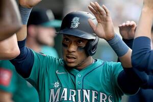 Seattle Mariners second baseman Jorge Polanco (7) celebrates in the dugout after scoring a run against the Detroit Tigers in the second inning at Comerica Park. editorial_image