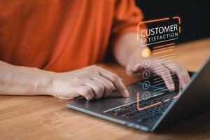 Customer experience concept, best excellent services rating by online application, customer using a laptop give ratings 5 point for feedback review satisfaction service opinion and testimonial. photo