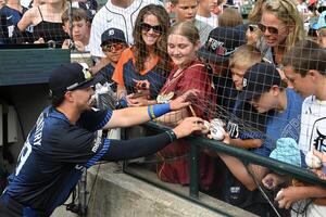 Detroit Tigers third baseman Zach McKinstry (39) signs autographs for fans before their game against the Seattle Mariners in the first inning at Comerica Park. editorial_image