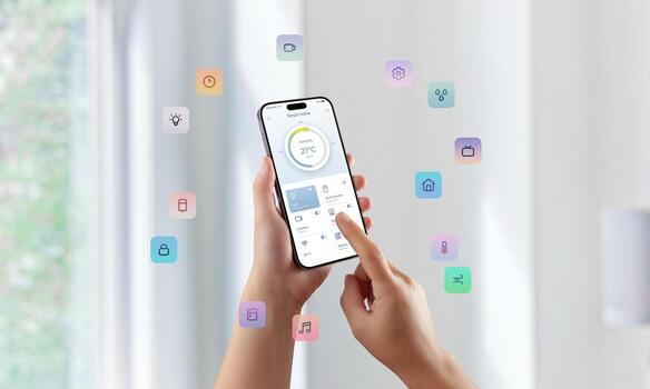 User controlling smart home features with floating colorful icons surrounding smartphone screen photo