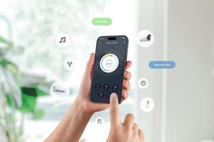 Smart home app with cooling control and security status displayed on mobile screen in natural setting photo