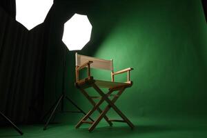 Chair of Film Director. Directors chair in green screen studio setup with softbox lighting. Ideal for filmmaking vdo production photo interviews and creative content with green chroma key background