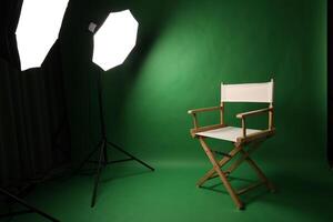 Chair of Film Director. Directors chair in green screen studio setup with softbox lighting. Ideal for filmmaking vid production photo interviews and creative content with green chroma key background