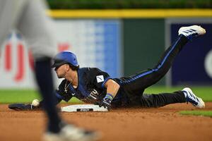 Detroit Tigers third baseman Zach McKinstry (39) slides safely into second base for a steal after the throw got away from Seattle Mariners shortstop J.P. Crawford (3) in the sixth inning at Comerica Park. editorial_image