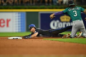 Detroit Tigers third baseman Zach McKinstry (39) slides safely into second base for a steal after the throw got away from Seattle Mariners shortstop J.P. Crawford (3) in the sixth inning at Comerica Park. editorial_image
