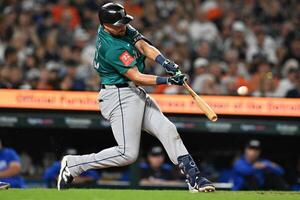 Seattle Mariners designated hitter Cal Raleigh (29) hits a grand slam home run against the Detroit Tigers in the ninth inning at Comerica Park. editorial_image