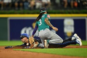 Detroit Tigers third baseman Zach McKinstry (39) slides safely into second base for a steal after the throw got away from Seattle Mariners shortstop J.P. Crawford (3) in the sixth inning at Comerica Park. editorial_image
