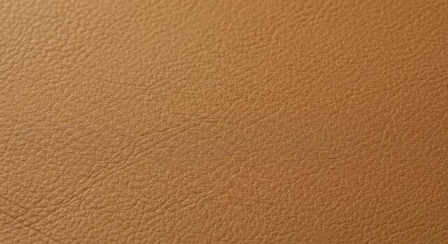Closeup of Textured Brown Leather Surface with Subtle Color Variations. photo