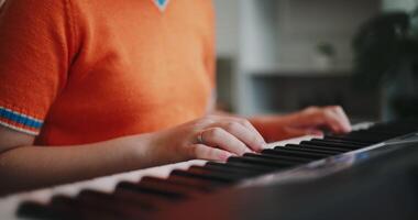 Close up shot, Woman's hands practicing playing the piano keyboard with relaxation and happiness in the living room. video