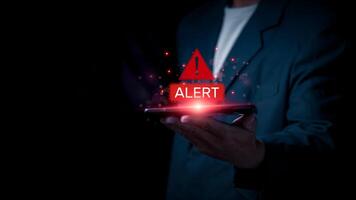 Emergency alerts on smartphones, concept of protection against cyber intrusion and attacks on computer networks, virus, spyware, malware, and ransomware for data security of the economy. photo