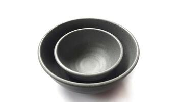 Stack of empty circle grey bowl with ceramic melamin material isolated on white background photo