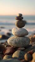 Balanced stone stack smooth rock beach sunset calm peaceful nature harmony photo