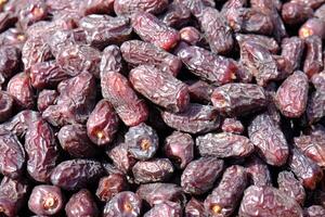 Bulk medjool palm dates at the market stall. photo