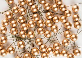 Artificial berries on wire for needlework and decoration of gifts, wreaths on white background photo