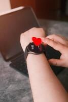 Close up of woman checking beat rate on smartwatch. Healthcare and technology concept. Application track health. photo