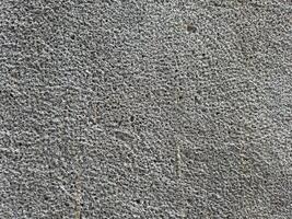 Porous cement wall with holes in it, wall background photo
