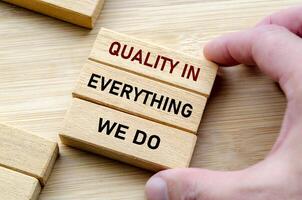Quality in everything message held with both hands symbolizes attention to detail and pride in craftsmanship photo