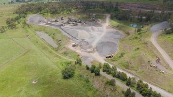 Aerial view of quarry with active trucks video