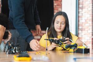 Young Students Exploring Technology with Robotics and Virtual Reality, STEM Education Diverse Girls Learning About Engineering and Innovation, Teacher Guiding Girls in Robotics and VR Class photo