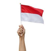 hands holding the red and white flag that flutters beautifully on Indonesian Independence Day photo