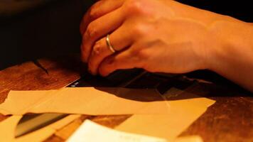 Hands folding and creating paper art video