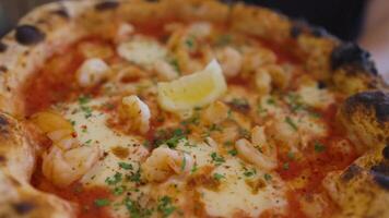 Delicious prawn pizza with lemon slice video