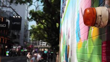 Vibrant mural and bustling street in Hong Kong video