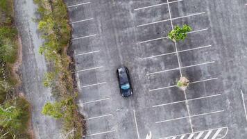 Aerial view of Tesla in deserted parking lot video