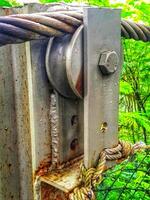 Rusty Metal Pulley System with Steel Cable and Rope photo