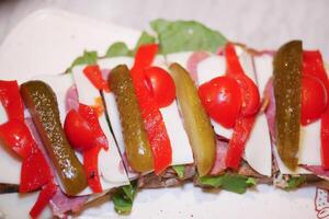 Colorful Open-Faced Sandwich with Vegetables and Cheese on Wholegrain Bread photo