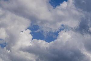 beautiful picture of clouds cumulus clouds, with a gap to the blue sky photo