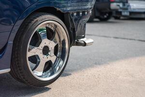A close up of a car with a tire on it photo