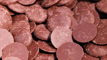 Chocolate disks moving or being arranged video