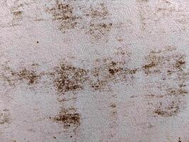 Close-up of surface with dark spots and textures photo