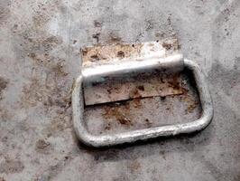 Rusty Metal Handle on Textured Surface photo