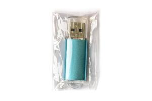 USB flash drive in transparent packaging isolated on white background. photo