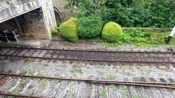 Train arriving at Wrexham station in scenic Wales video