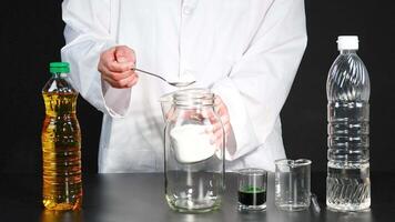 A step-by-step demonstration of creating a homemade lava lamp using oil, water, and dye in a laboratory setting video