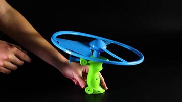 Pulling string to launch flying toy video
