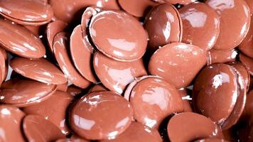 Close-up view of chocolate buttons moving video