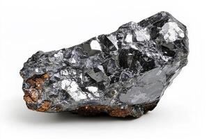 Close up shot of a dark metallic mineral specimen with crystalline structures on white backdrop photo