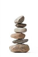 A stack of six smooth stones balanced on top of each other against a white background space photo
