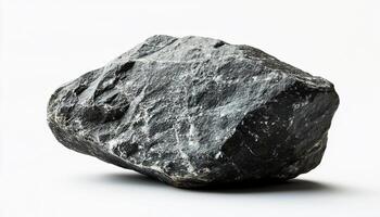 A close up view of a dark gray rock with white streaks against a white background studio shot photo