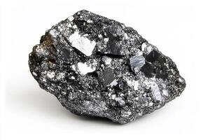A close up shot of a dark, rough mineral rock with shiny, reflective flakes on white background photo