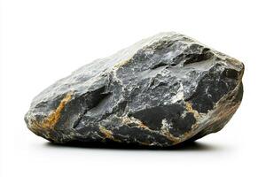 A close up shot of a single dark gray rock with yellow veins on a white background surface photo